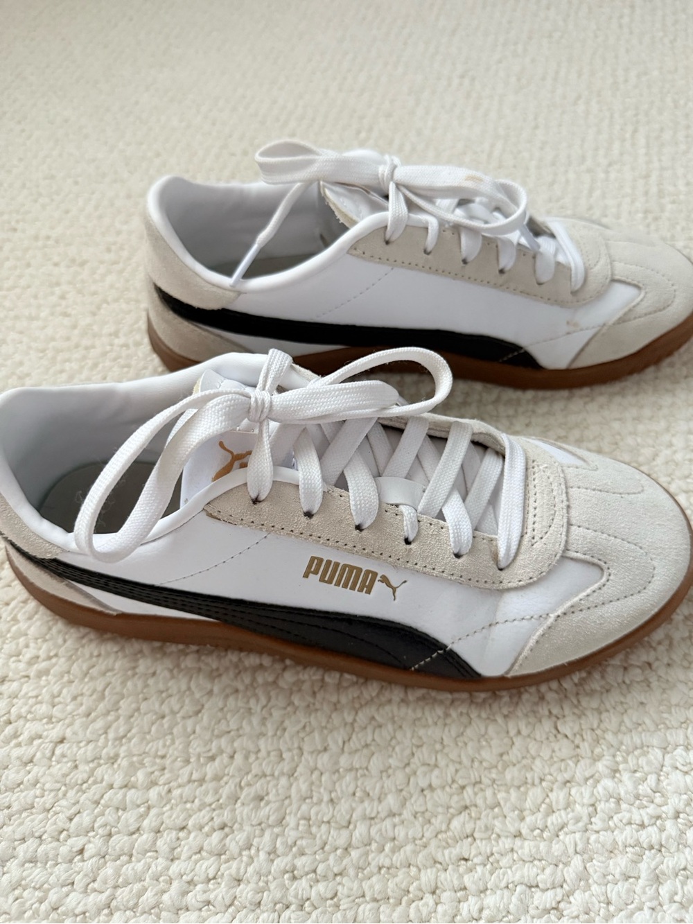 Puma Women's White Sneakers with Black Stripe and Gum Sole